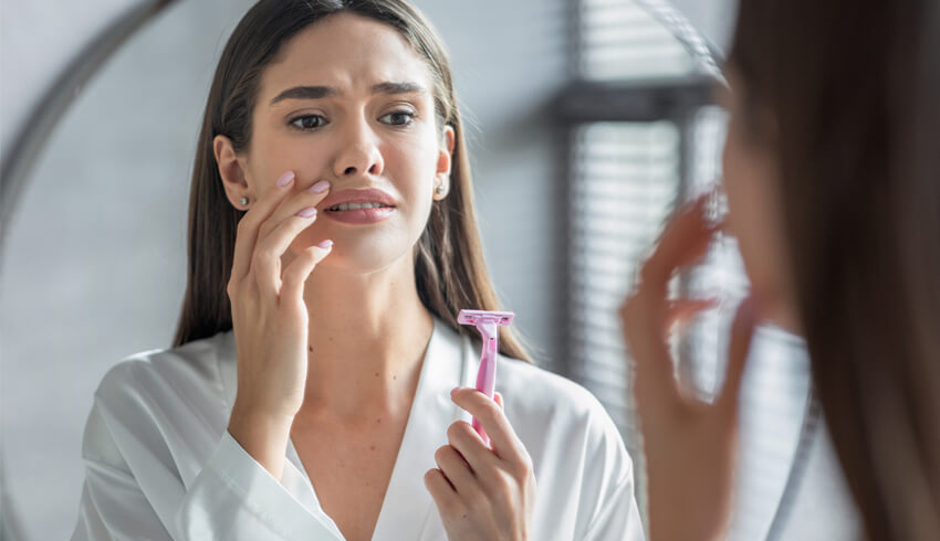 A lady holding a shaver
